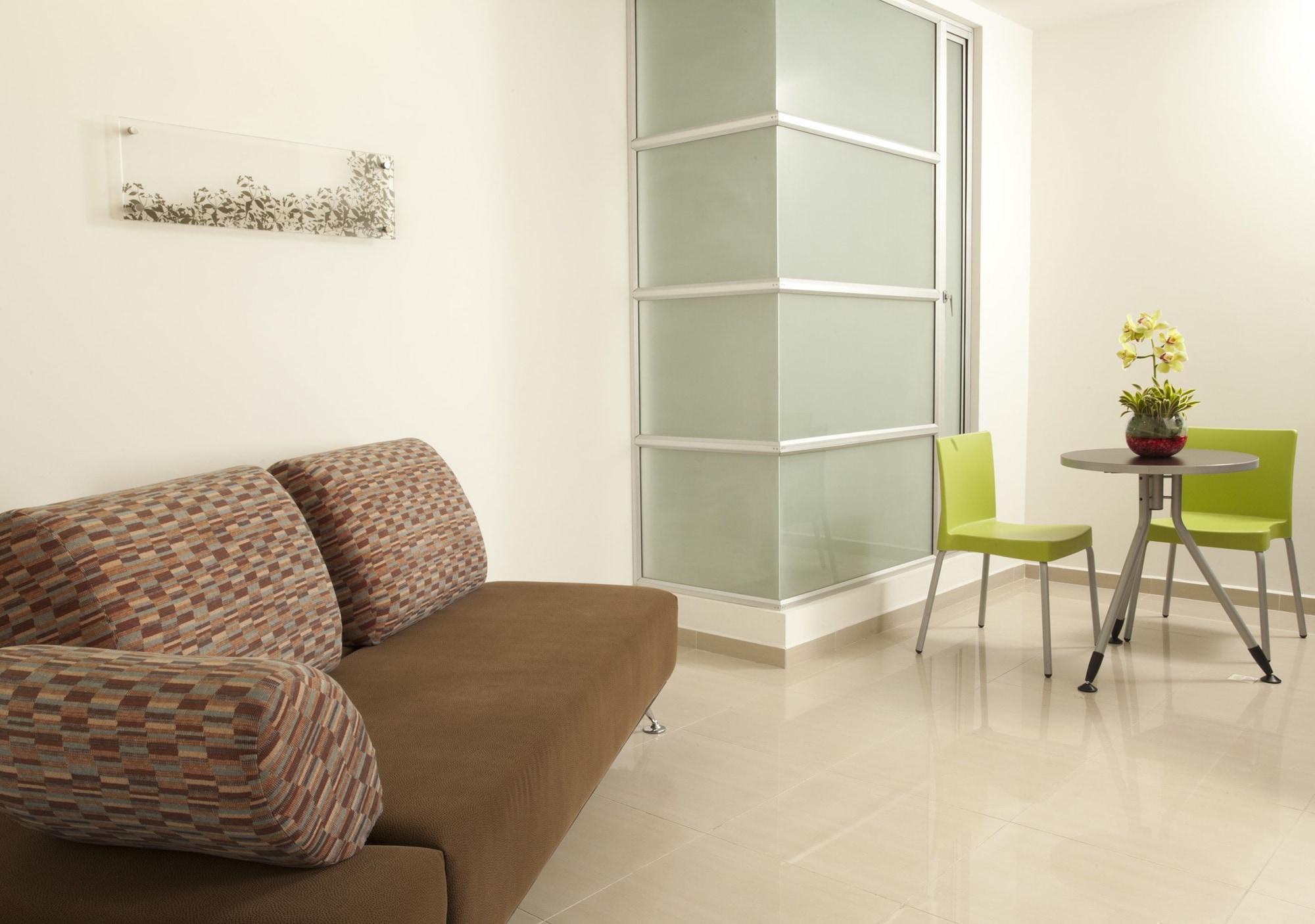 San Simon Hotel Pereira By Soratama 外观 照片 A room with a vinyl floor